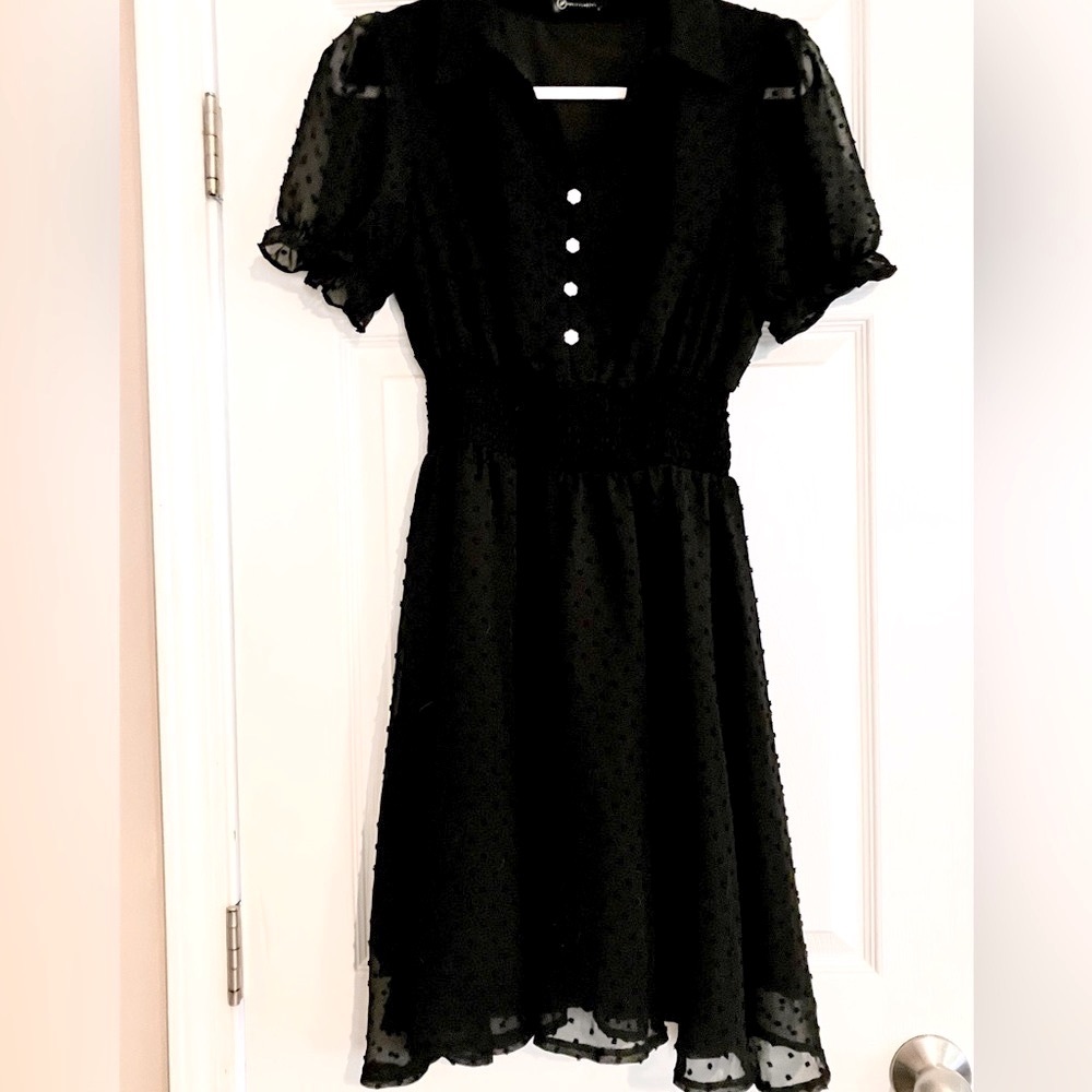 Black dress with flower buttons